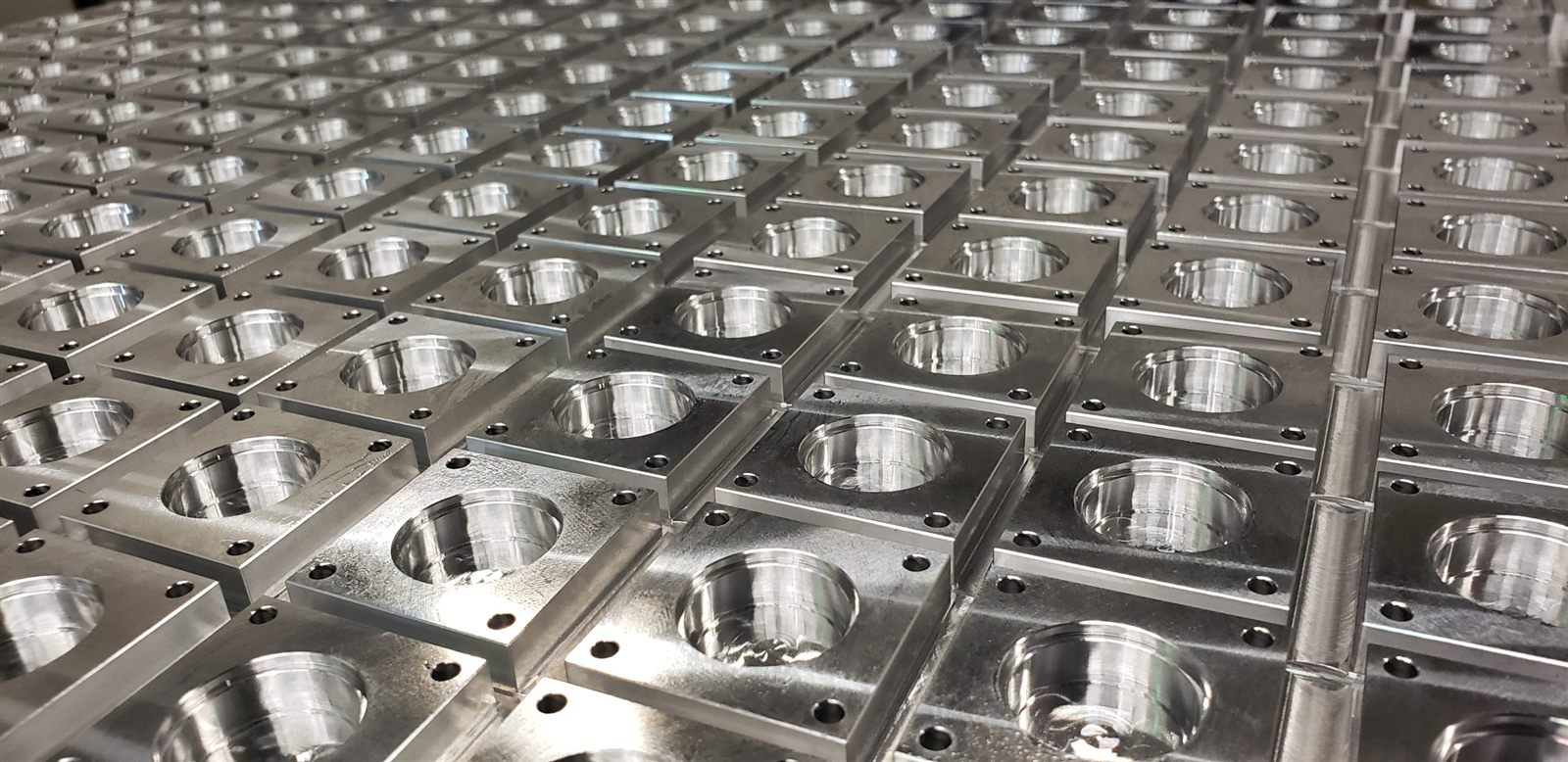 Production batch of matching machined housings