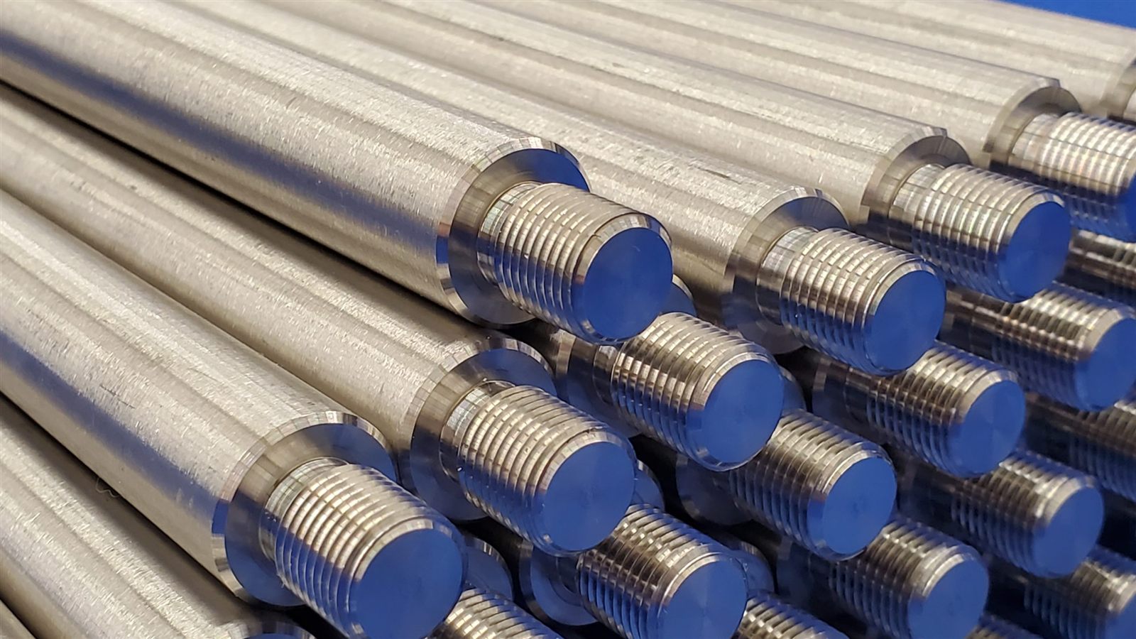 Production batch of threaded metal components from Reformed Manufacturing